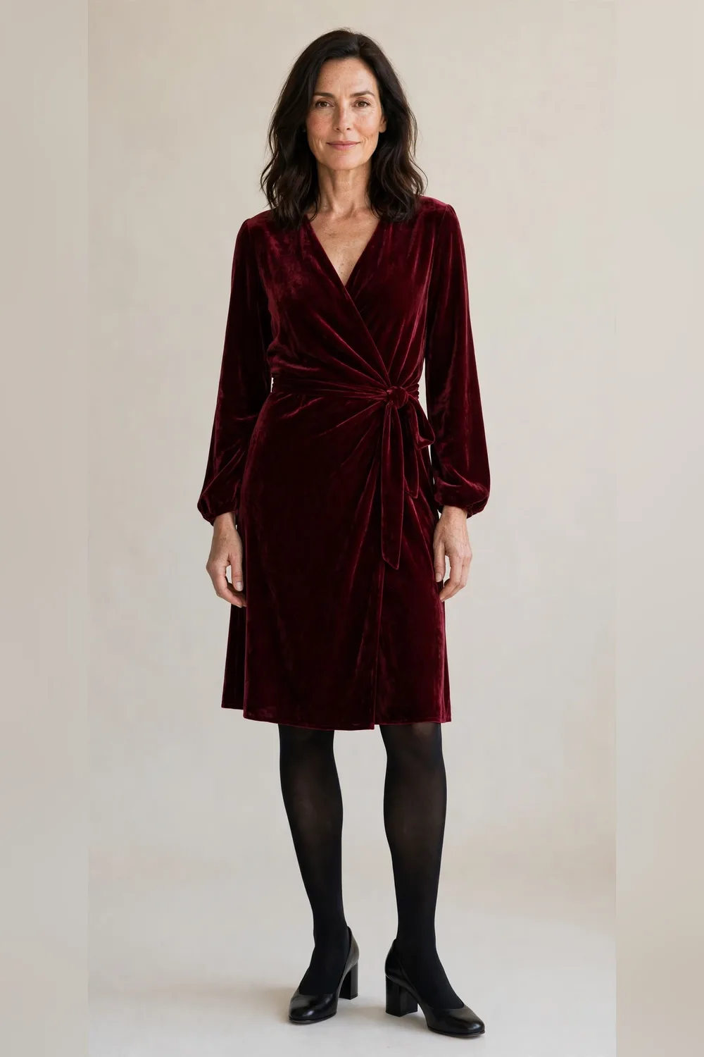Burgundy velvet wrap dress with black tights and block heels