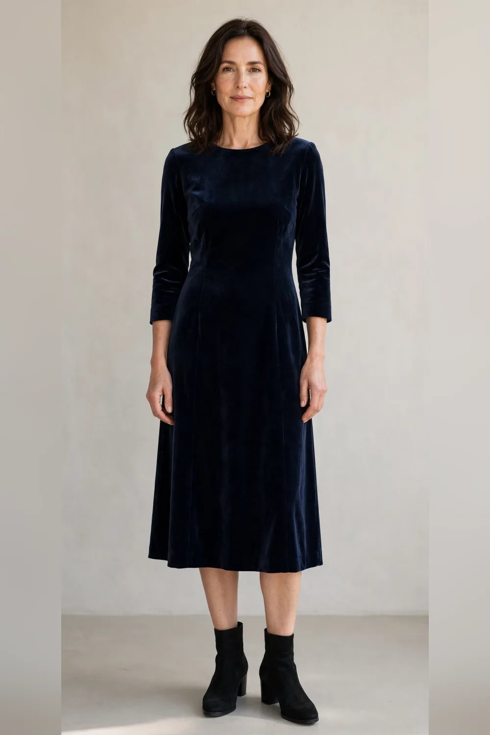 Navy velvet dress with black ankle boots for a family Christmas dinner