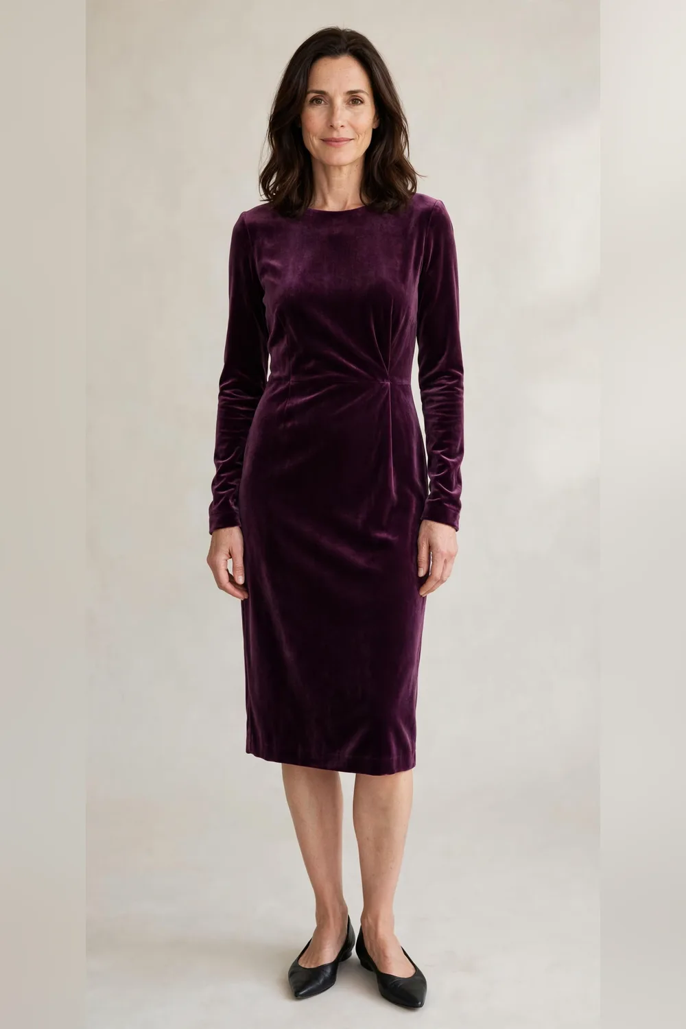 Plum velvet dress with black pointed flats for Christmas dinner at home