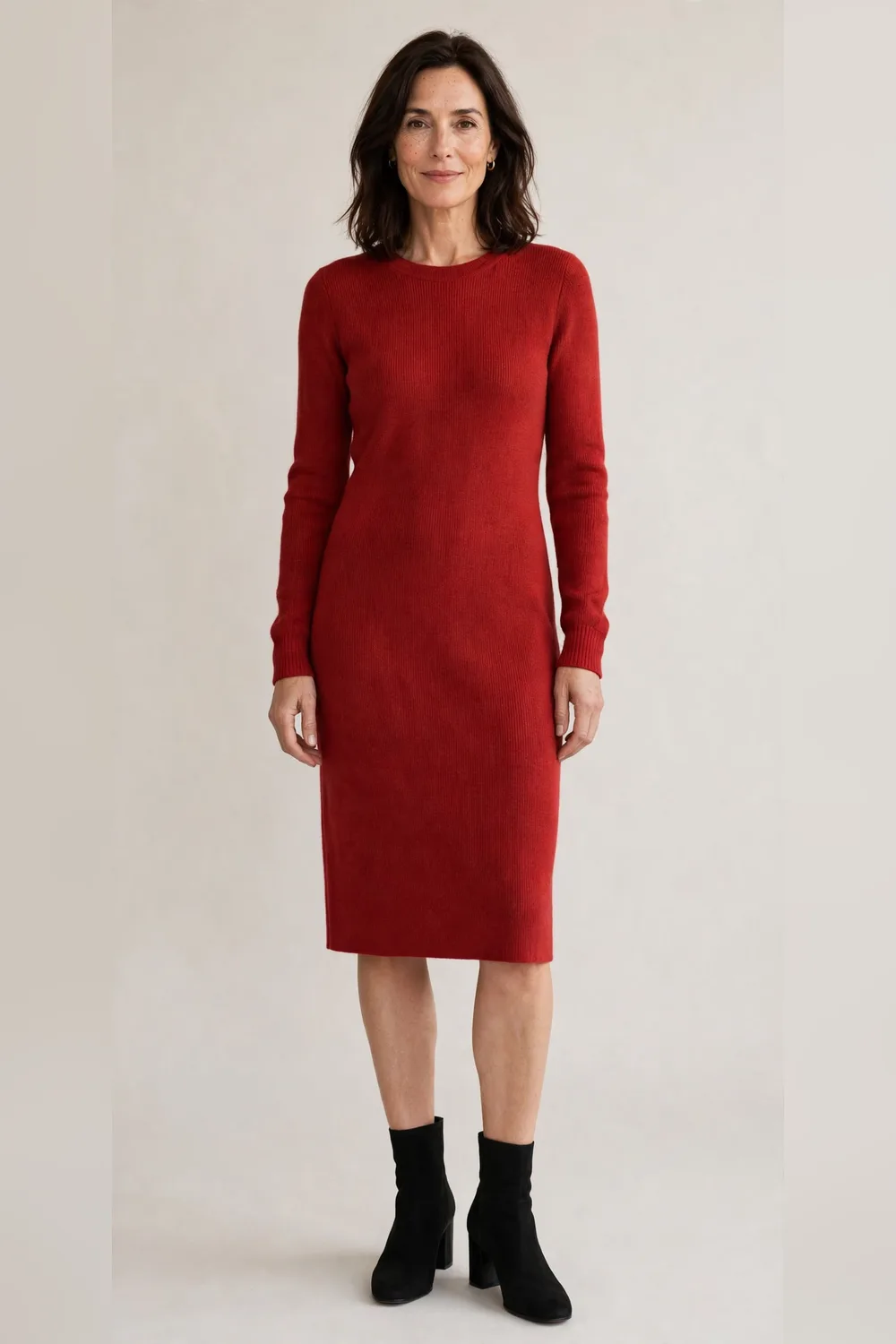 Red fine-knit dress with black ankle boots for Christmas dinner