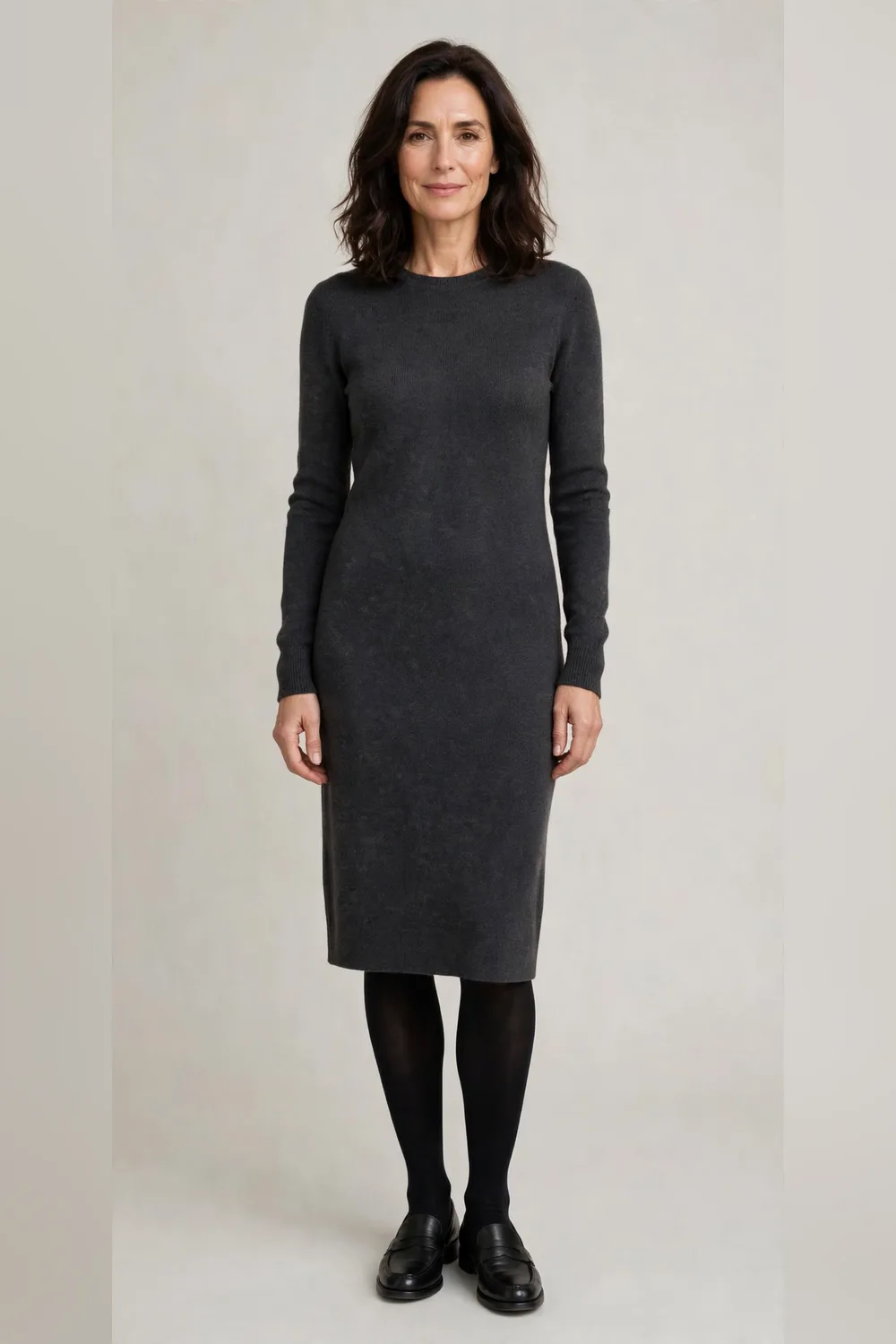 Charcoal knit dress with black tights and loafers for Christmas dinner