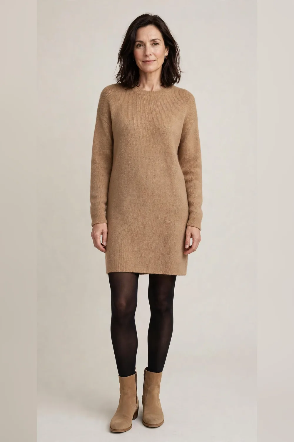 Camel knit dress with dark tights and tan ankle boots