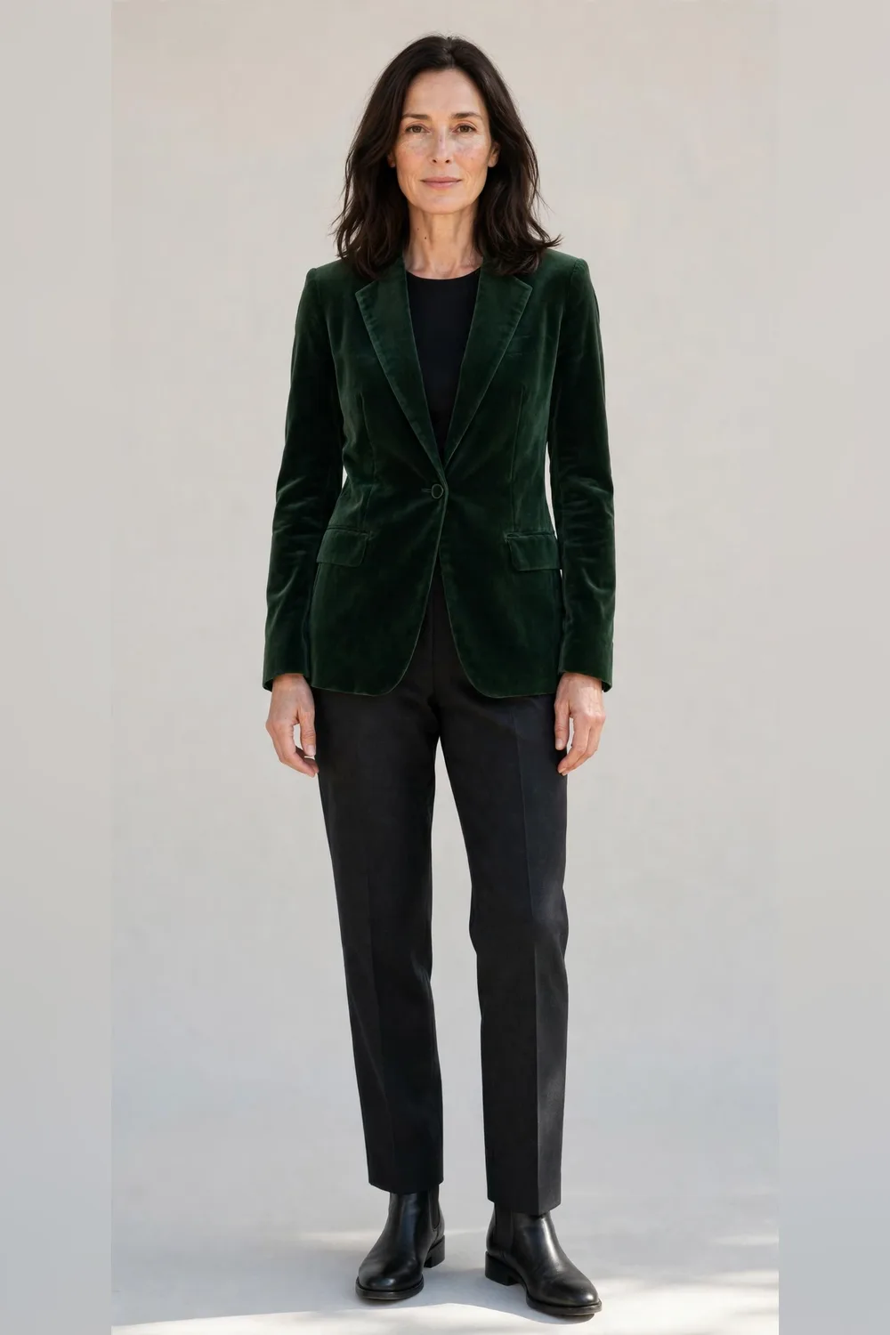 Dark straight trousers with a green velvet blazer and boots for Christmas dinner