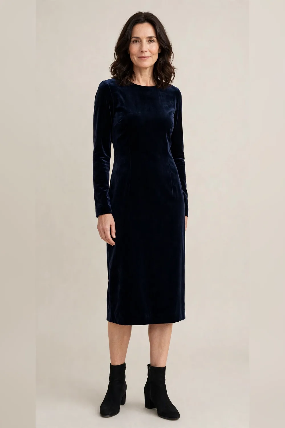 Navy velvet dress with black ankle boots for an office Christmas party