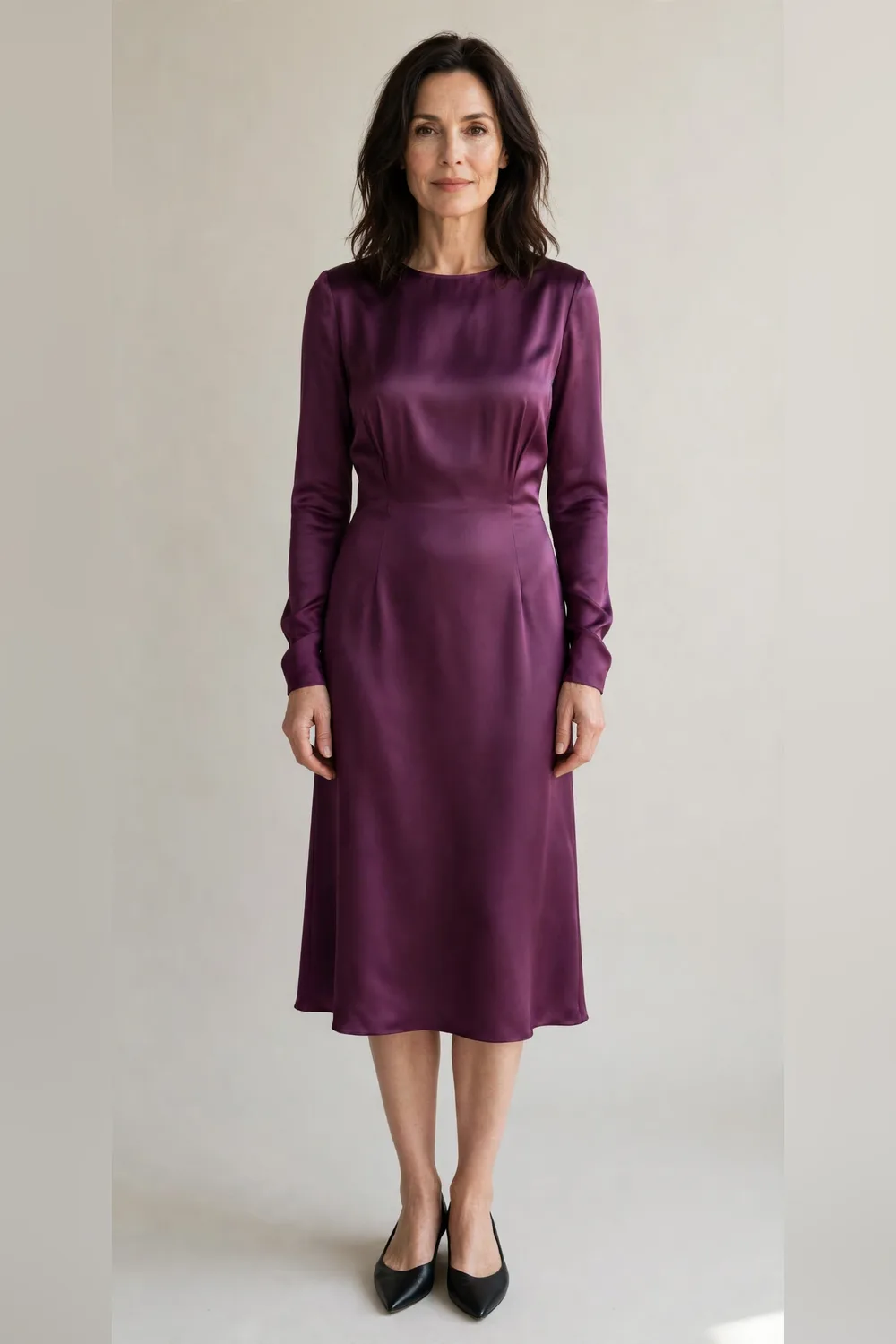 Plum satin dress with black pointed flats for an office Christmas party