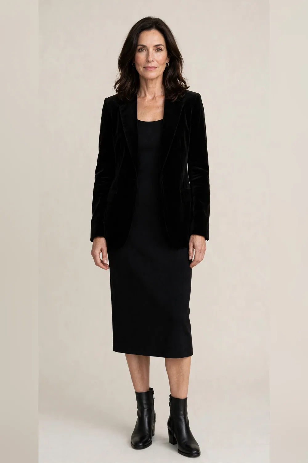 Black velvet blazer over a simple black dress for an office Christmas party