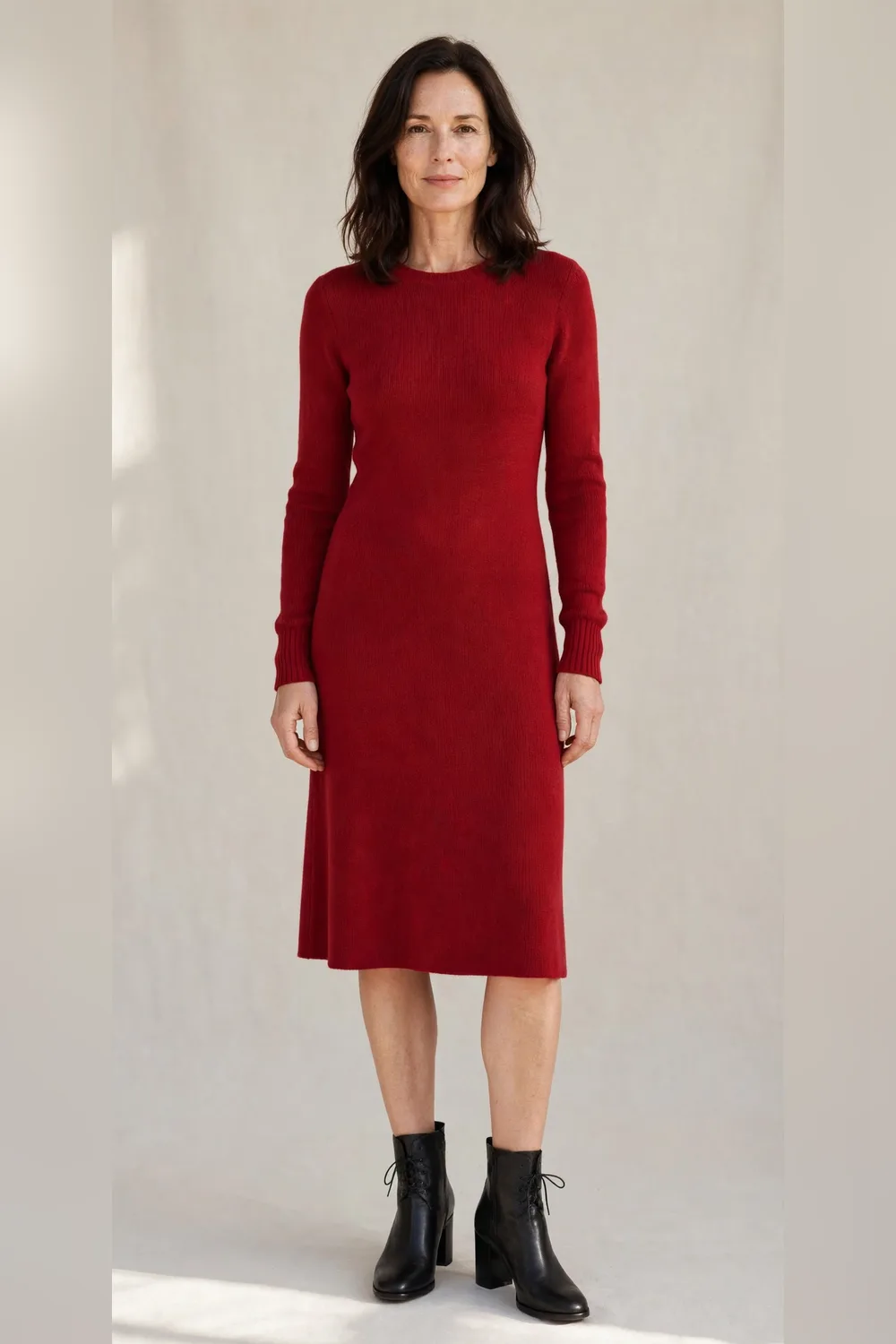 Red knit dress with black ankle boots for an office Christmas party