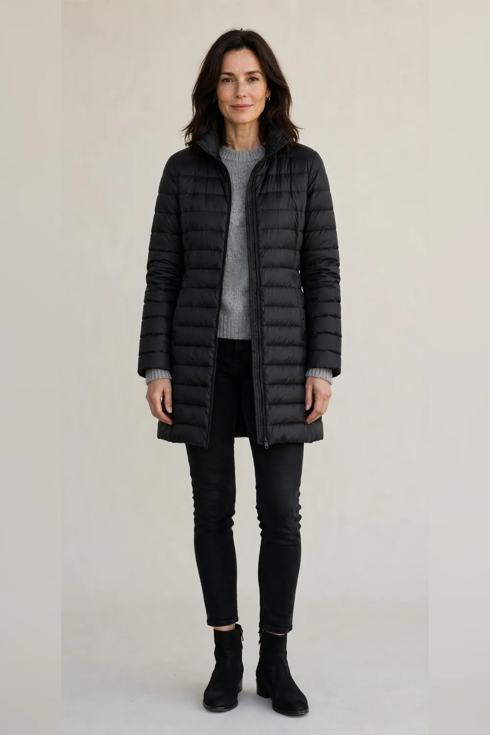 Black puffer coat with black skinny jeans and ankle boots