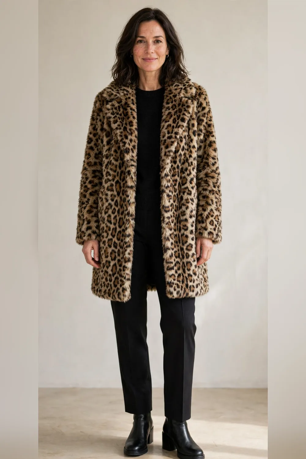 Leopard faux fur coat with black trousers and black ankle boots