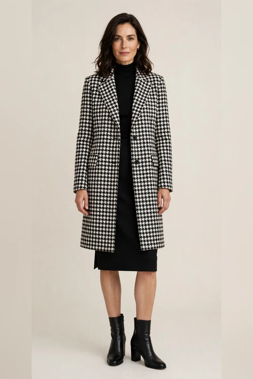 Houndstooth coat with a black pencil skirt and heeled boots